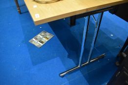 A modern beech laminate work desk, folding legs
