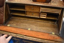 An early to mid 20th Century oak burea having linen fold decoration , dimensions approx. H106 W89