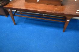 A vintage stained frame coffee table, having undertier and styslised legs