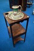 A Georgian mahogany night stand having later jug and bowl set