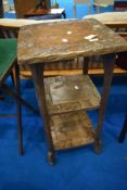 A rustic carved plant stand, height approx 87cm