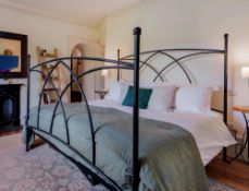 A black iron frame superking bed frame (base mattress and bedding not included), width approx 187cm