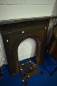 A Victorian style cast iron fire surround and grate