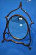 A 19th Century mahogany frame toilet mirror having shaped angled frame