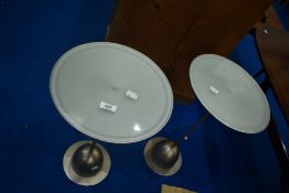 A pair of modern designer brushed chrome and glass side table, labelled Umbra