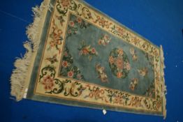 A Chinese rug, approx. 220 x 125cm