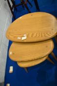 A modern Ercol 'pebble' nest of three tables