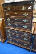 A nice quality reproduction chest on chest, in the Georgian style having large brass handles ,