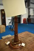 An early 20th Century table lamp having carved column, height approx 59cm, diameter of base 20cm