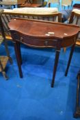A reproduction mahogany hall table