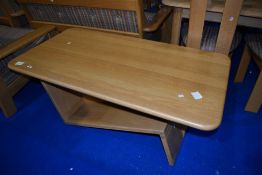 A modern light wood coffee table, of similar design to lots 629 & 630, approx. 129 x 70cm