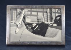 A 1930's George VI Silver photograph frame, of plain rectangular form with engraved initials M.C.
