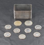 A George VI cased silver napkin ring, of rectangular form with engine-turned decoration around a