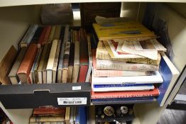 A shelf of vintage and modern books, including 1928 first edition of Prince Charlie and the border