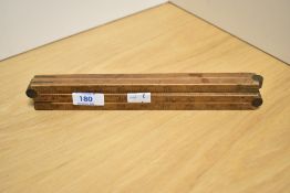 A vintage box wood folding yard stick.