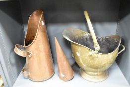 A brass coal helmet, a copper coal scuttle and a copper grain measure.