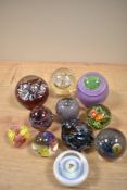 A selection of paperweights, including Caithness miniature pansy.