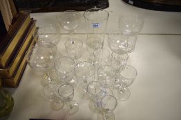 A collection of antique glasses, including etched and wine glasses and tumbler with etched logo; '