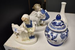 A pair of mid-20th Century German porcelain figural ornaments, a Wedgwood Meadow Sweet bud vase, and