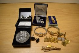 A collection of gentlemen's accessories comprising various cufflinks, tie/shirt studs and a tie pin,