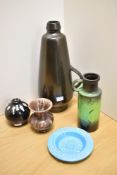 A gun metal grey West German vase, of bullet shaped form, a green west German vase, a brown example,