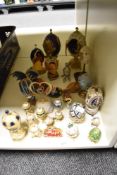 A collection of decorative ornamental egg shaped trinket boxes, some with scenes inside and