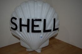 A vintage Shell glass globe as found