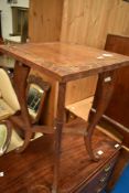 A carved occasional table or plant stand