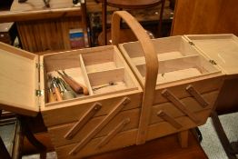 A vintage cantilever sewing box , containing accesories including crochet hooks