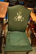 A vintage mahogany framed armchair having embroidered back
