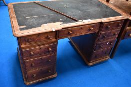 A Victorian pitch pine pedestal style desk, approx. 130 x 72cm