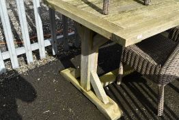 A large teak garden table, approx 290 x 90cm, labelled Neptune