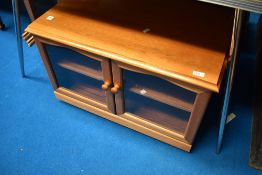 A modern/vintage teak effect TV cabinet