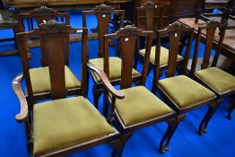 A set of seven (six plus one) early 20th Century oak dining chairs
