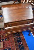 An early 20th Century bureau having ball and claw feet, width approx 78cm