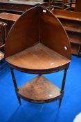A 19th Century mahogany corner washstand or shelf, with faux drawers to both friezes