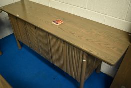 A modern bespoke Ercol sideboard, Silver mist design, with slide out cocktail section to centre,