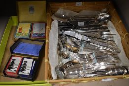A mixed lot of Community Plate cutlery and two packs of vintage playing cards.
