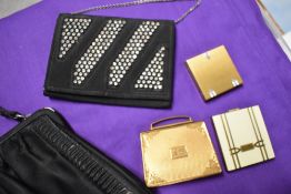Two vintage evening bags and a trio of compacts one monogrammed 
