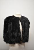 A 1930s black fur stole.