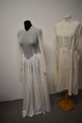 A 1930s/ 1940s white lace and grosgrain dress, having tie belt to waist, full length fitted