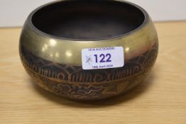 A machine made brass Tibetan Buddhist singing bowl.