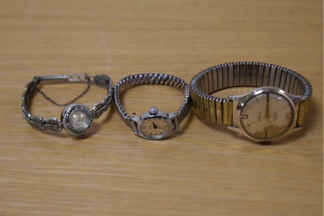 A collection of wristwatches comprising a Smiths Empire, a Timex on an extending bracelet strap