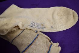 A pair of 1930s brown flat shoes, size 4 and a pair of 1930s silk socks.