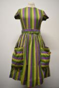 A 1950s 'Little Eve' cotton day dress, having original belt, large patch pockets to front with large