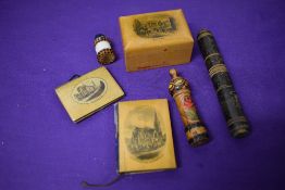 A selection of Mauchline ware and treen, including St Peters church Bournemouth needle case, Union