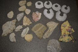 A selection of antique and vintage childrens and ladies bonnets and caps, many with intricate