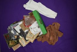 An assortment of vintage and retro stockings and tights, including early 20th century white
