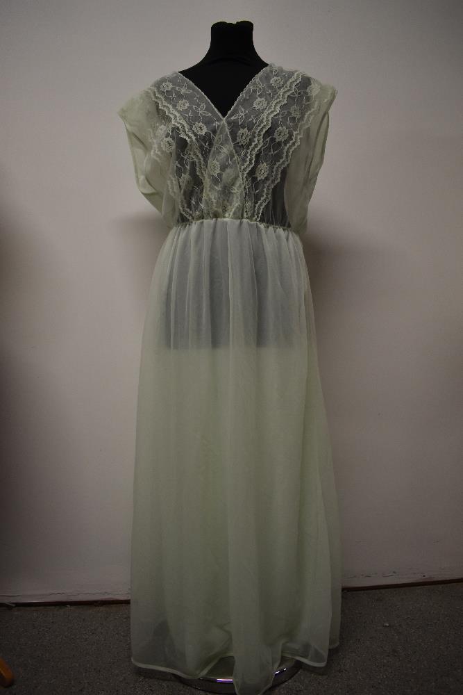 A vintage mint green nylon nightdress, having double layered skirt and floaty lace to bodice,