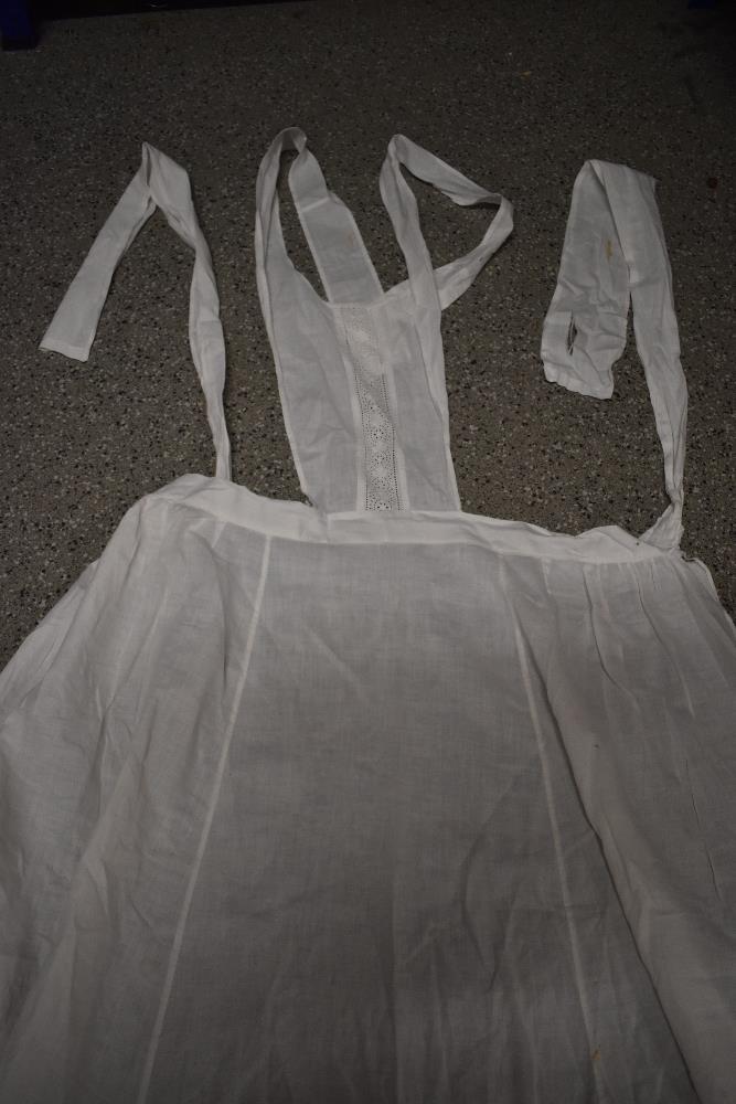 A large collection of Victorian to early 20th century petticoats and aprons, many with intricate - Image 9 of 12